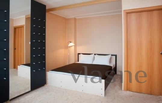 The bedroom is a large bed, sofa bed, w / a TV, connected wi
