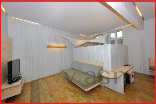 The apartment is designed in the style of hi-tech. Modern fu