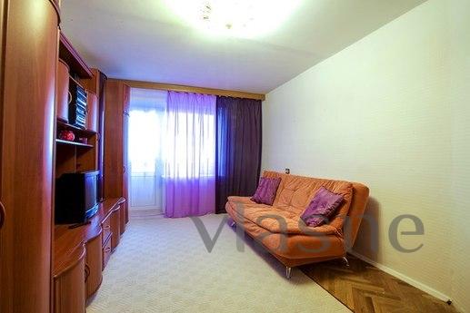 The apartment is located in a warm brick building, a sixteen