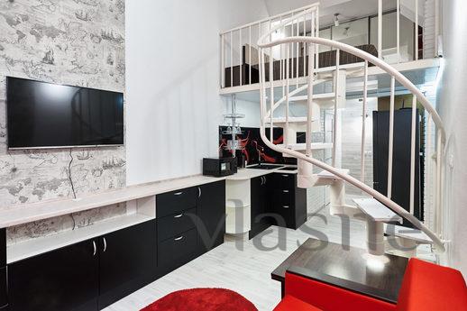 Rent a two-level loft with designer repair. A new, clean apa
