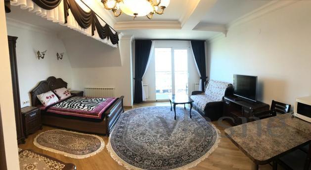 The house is located in a quiet place in the area of the cen