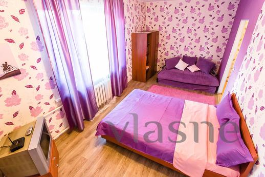 The interior of the bedroom in shades of lilac and lavender 