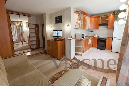 The house is located in the city center, with well-groomed l